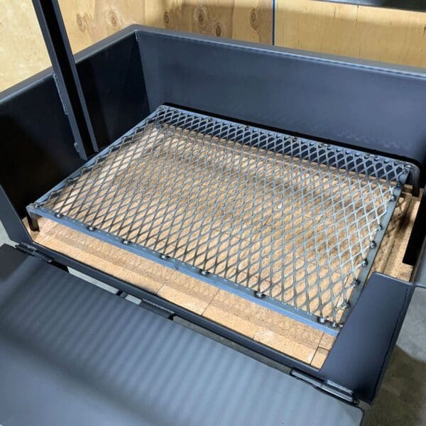 Charcoal screen for airflow in a wood grill.
