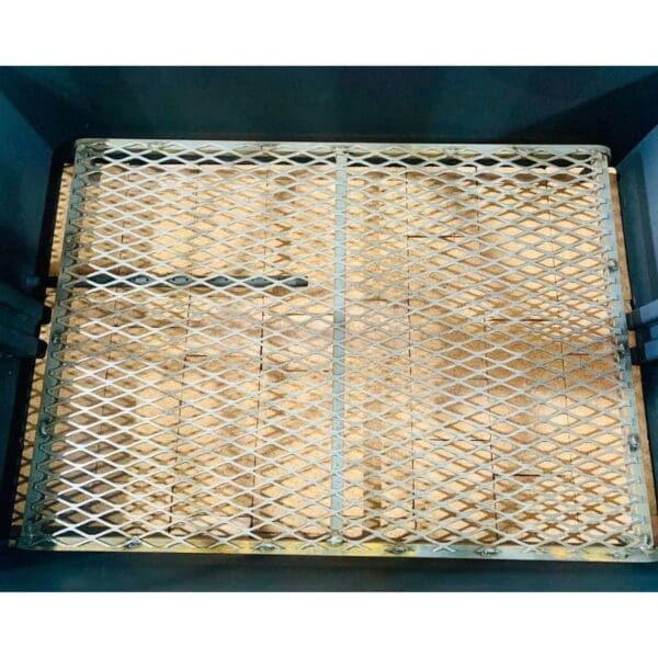 Charcoal grates keep wood elevated to facilitate airflow in a Santa Maria grill.