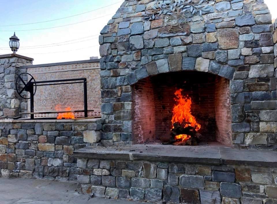 Flagstone BBQ Island with an Argentine BBQ Grill Installed