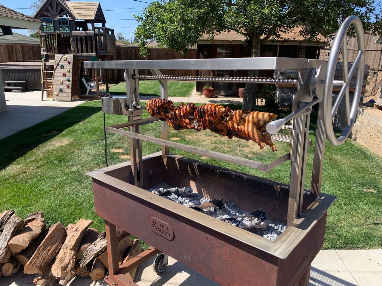 Argentine-Style-Grill-with-height-adjustable-Rotisserie-Cooking-chicken__15081.1660177162.1280.1280