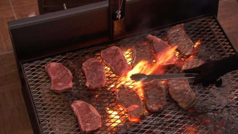 Ribeye steaks master chef on live fire grill